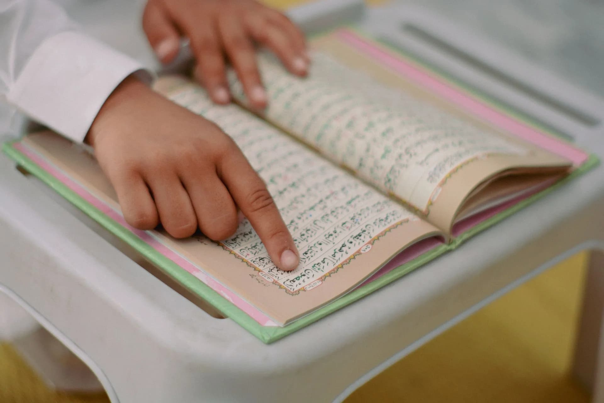 Young student memorizing the Quran with an online Hifz teacher
