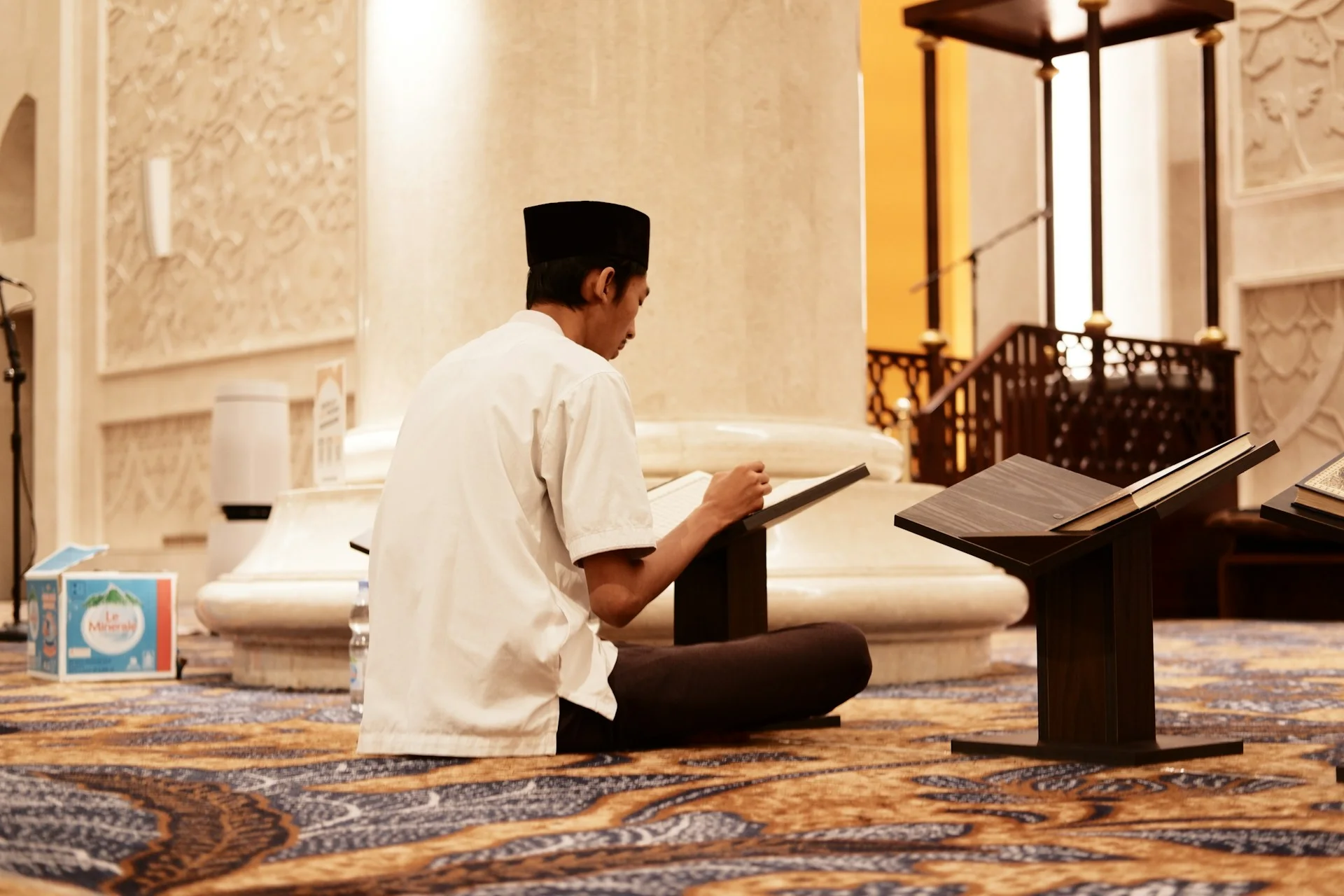 Muslim man reading Hadith book explaining Sunnah of Prophet Muhammad